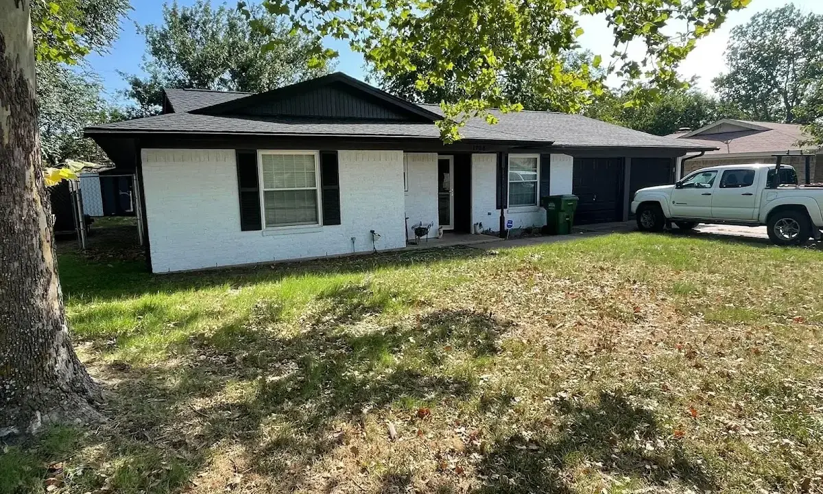 Professional roofing crew working on a residential roof in Duncanville